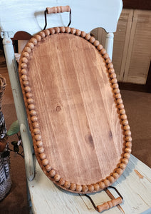 <p><span data-mce-fragment="1">Oh, the possibilities! This oval wooden beaded tray makes a lovely accent on any table. Fill it with collections, fun treasures, or seasonal decor. We love that you can lift it all up and out of the way if you need to ~ making it a must-need accessory for your home!</span></p> <p><span>2.75" H x 21" W x 12" D (width includes handles)</span></p> <p><span>Wood, metal</span></p>