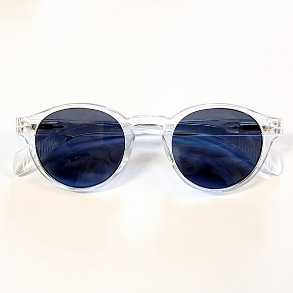 We love this clear acrylic sunglass frame round with smoke lenses! It offers a chic and modern twist on classic eyewear. The transparent frames add a contemporary flair, effortlessly complementing any outfit.