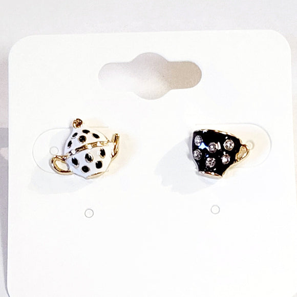 Care for a SPOT of tea?  You'll get compliments on these playful black and white teapot and teacup post earrings. They are a whimsical and charming, mismatched pair that celebrates the joy of tea time. They feature a white with black polka dot teapot and a black rhinestone-covered teacup. The intricate detailing and contrasting colors create a playful and eye-catching look.