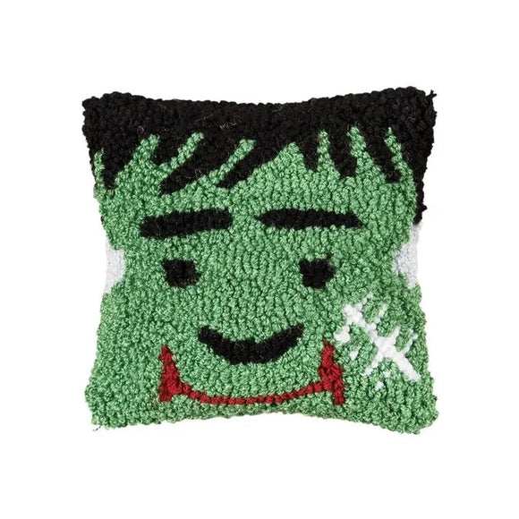 Everyone needs this Frankenstein pillow for Halloween! With its smiling green face, it is the most adorable thing that you've seen!  We love its size! It is sure to bring fun to your pillow party and will mix nicely with the ones you already have! It will be sure to be a graveyard smash!   8″ x 8″ x 3″  Acrylic front, Cotton canvas backing, Polyester filling