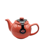 When it's time for a spot of tea, reach for one of our stoneware teapots, which can absorb the heat of boiling water without cracking. Likewise, the beautiful exterior is protected with a gloss to prevent the paint from warping or rippling. The classic bulbous shape allows tea leaves or bags to move freely for just the right amount of flavoring.&nbsp;

Flamingo colored&nbsp;teapot is available in 2-cup or 6-cup size