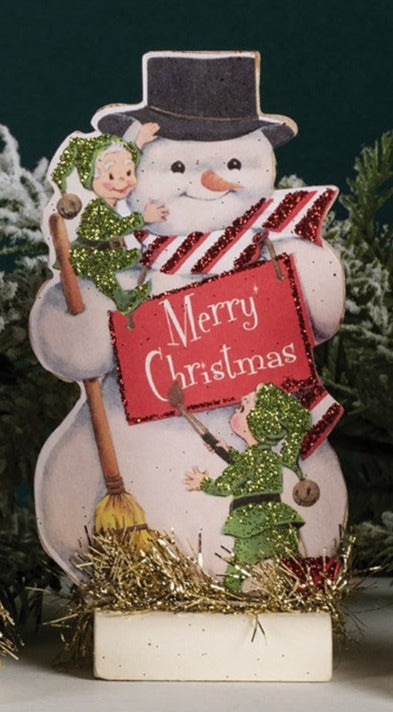 This vintage-inspired wooden snowman is holding a 