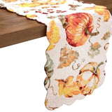 Welcome the changing of the season with this beautiful watercolor pumpkin table runner! It features a beautiful pumpkin and leaf design that reverses to a coordinating striped pattern for additional styling options. Perfect for adding a touch of warmth to any autumn-themed table setting, this cotton runner is sure to be the highlight of your home decor this season! Finished with a scalloped edge, this tabletop collection is crafted of 100% cotton and hand-guided machine quilting.