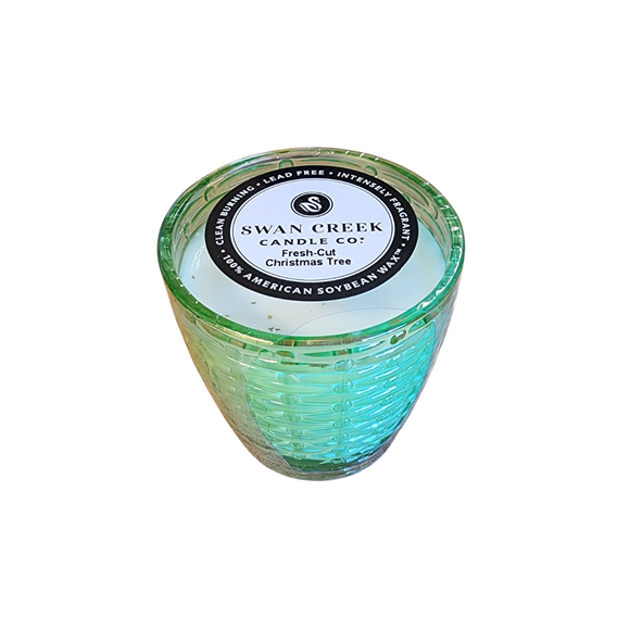 You'll love our cathedral small vase candle. This fresh cut Christmas tree candle has been poured into a pretty basketweave frosted green glass.

Take a trip back to your childhood of heading to town, ice skating, Christmas lights, and the beautiful pine smell of picking out your perfect tree! 

Filled with 4.5 oz. of American Soybean WaxTM. Measures 3