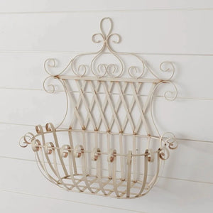 A great piece to put inside to bring the look of the outdoors in!  Put flowers in it, or use it in the bathroom for towels for your guests!  19" H x 18" W x 8.5" D  Metal