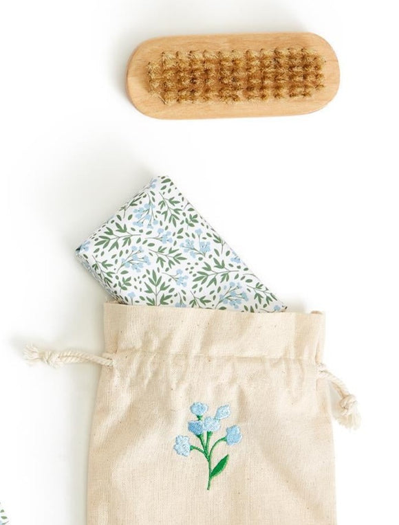 How adorable is this gardener's care kit? Includes a nail brush and garden-scented soap to clean off all that dirt and soil from a hard day's work of gardening. The set comes packed in an adorable cotton canvas drawstring bag with a cute embroidered blue flower on the font. The perfect gift for all garden lovers!  Brush: 3 3/4