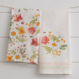 Happiness is a pretty pair of tea towels in your kitchen! We love the pink and yellow flowers scattered in with white daisies and bumble bee patterns.  One towel has a pattern all over it; the other has a bouquet of flowers with a sweet faux embroidery print along the bottom.  27" H x 17" W  Cotton