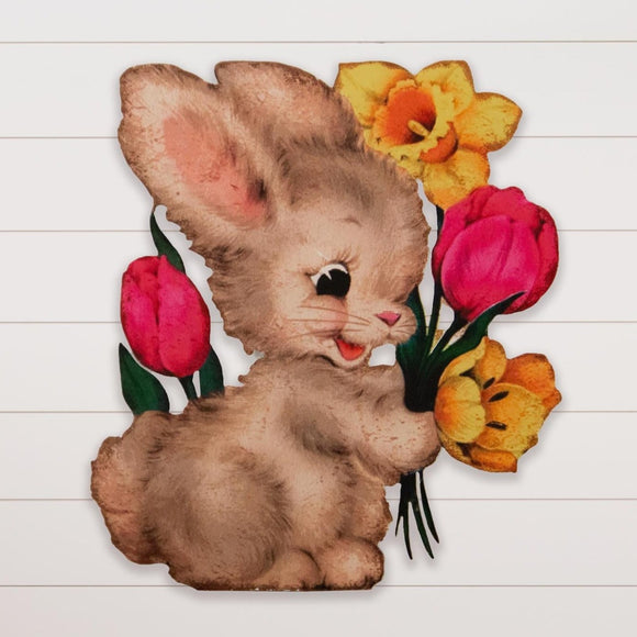 This adorable grey bunny is ready for spring! He's been picking a bouquet of yellow daffodils and pink tulips for you. Hang it up, or lean him against a big easter basket handle with grass at his feet - he will bring a vintage flair to your spring decor this year!  18.5