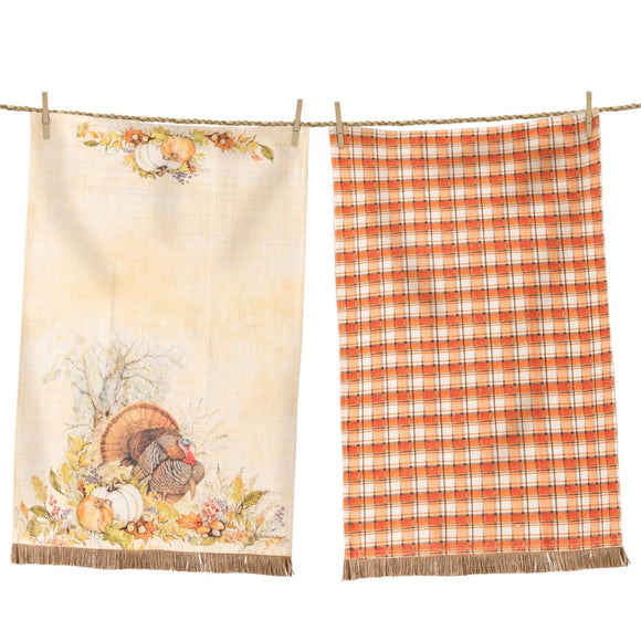 Get ready for fall with our Turkey towel set! One towel is a pretty orange, cream, and brown plaid with an accent burlap fringe at the bottom. The other has a beautiful watercolor-style turkey with pumpkins, leaves, and acorns around it, a cream background, and the same burlap fringe along the bottom of the towel.  27