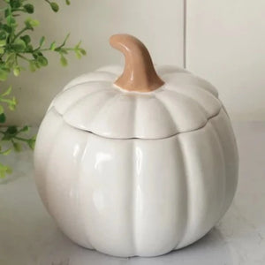 This beautiful ceramic pumpkin is a soft white and will be the star of the show in your fall decorating!  It has a removable lid with a stem as the handle, which makes it easy to get into. Use it as a candy dish or to hold little trinkets.  Food Safe. Hand Wash; Do not Microwave  5.12" H x 5" Dia