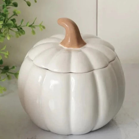 This beautiful ceramic pumpkin is a soft white and will be the star of the show in your fall decorating!  It has a removable lid with a stem as the handle, which makes it easy to get into. Use it as a candy dish or to hold little trinkets.  Food Safe. Hand Wash; Do not Microwave  5.12