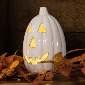 Say Hello to this cute white ceramic Jack-O-Lantern! You'll love to use him in your decorating for the fall!  Ceramic. Light Sold Separately  7.5" H x 4.5" Dia