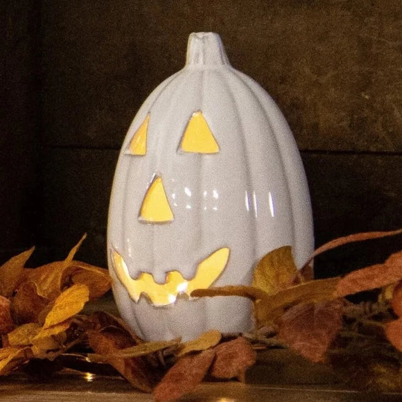 Say Hello to this cute white ceramic Jack-O-Lantern! You'll love to use him in your decorating for the fall!  Ceramic. Light Sold Separately  7.5