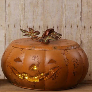 We love this large rustic orange distressed pumpkin! Its lid has copper color leaves, and a stem fits right on top. Use it to put your candy in for your trick-or-treaters, or stick a LED candle in it for some Halloween ambiance!  11"H x 15"D