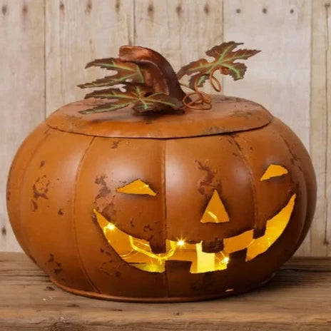 We love this medium rustic orange distressed pumpkin! Its lid has copper color leaves, and a stem fits right on top. Use it to put your candy in for your trick-or-treaters, or stick a LED candle in it for some Halloween ambiance!  10