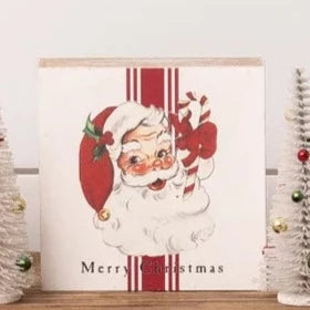 This charming vintage block sitter is hard to resist. It is cream and has a red stripe running through it, with a retro Santa holding a candy cane. The words "Merry Christmas" are below the image. It will certainly complete your decor this year for the holidays!  5.75" H x 5.75" W