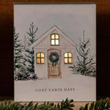 This adorable light-up block features a beautiful white farmhouse on the front and the words "Cozy Cabin Days" below. It has a six-hour on and 18-hour off timer (which we LOVE), so those lit windows will make those long winter nights a little brighter and happier!  6 H x 5 W x 1.5 D  MDF