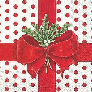 This sweet cocktail napkin looks like a present that needs to be opened! A white background with a red polka dot design on the paper is "wrapped" with a big red bow with a sprig of mistletoe tucked in.  Materials - Paper  20 per pkg: 3 ply - 5 x 5 in.