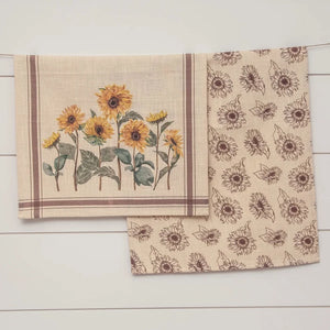 Bring on the SUN!  Sunflowers that is!  These gorgeous dishtowels have a linen-look fabric that is cream with a brown stripe all around the edges and sunflowers across the bottom half.  The second towel has the same background fabric as the first with brown sunflower outlines scattered all over it.  This towel set is guaranteed to make you happy!