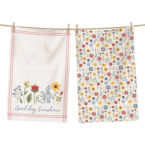 <p><span data-mce-fragment="1" mce-data-marked="1">Spread a little sunshine with this beautiful set of towels! The first towel is white with a red double-lined border. At the bottom are several flowers in blues, reds, and yellows, with the words "Good day, Sunshine" below in a blue cursive font. The second towel is a happy pattern of blue, red, and yellow flowers mixed with green leaves. These towels will just leave you happy when you see them!</span></p> <p>27" H x 17" W</p>