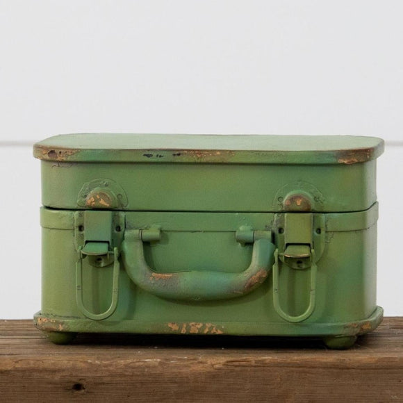 We love little display pieces to give parts of our home color and interest. This mini green suitcase does not disappoint!  Use it closed to give things height, or open it up and put some plants in it. It will bring a fun and colorful bit of whimsy to your home decor!  5.5 H x 9 W x 5.5 D  Metal