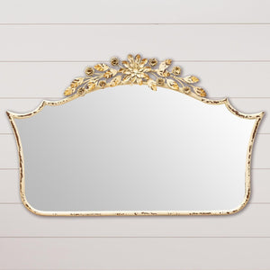 This French-inspired mirror is gorgeous! It will bring a little romance into your home with its metal floral garland above the center. It would look wonderful above a dresser or a tall, narrow table in your hallway. Its cream finished is distressed, and a bit of the rusty iron shows through - beautiful!  20" H x 31" W  Iron