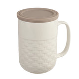 This 15oz Weave tea infuser mug is made from new bone china and has a gray silicone top. The exterior of the tea infuser mug features a weave-textured design. The top part of the mug where you drink is a smooth finish. The mug's interior is white, allowing you to see the color of the tea. The mug includes a stainless steel filter for loose-leaf tea and tea bags. The mug has a comfortable handle and a nice weight and feel. It is not too heavy. The handle does not get hot in the microwave.
