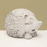 <p>This hedgehog has a distressed white finish and is made of concrete and is too cute! He can be put inside or outside.<span></span></p> <p>Approximately 6" W x 4.5" H x 3.5" D</p>