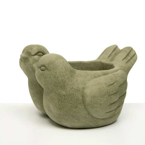 <p>This cute little verde green double bird planter holds a 4.25" x 4" potted plant. It will look sweet out on your porch, your kitchen table, or in your garden with a plant or as a mini bird bath.<span></span></p> <p>Approximately 7.5" W x 5" H x 6.25 D</p>