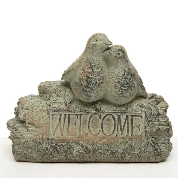 <p>This little welcome sign will greet guests entering your yard, garden, or home! Two weathered blue/green birds sit on a log with the word 