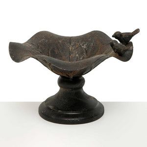 <p>This bronzed distressed metal birdbath has two birds on one side, ready to take a drink! You can use this as a bird bath or feeder, or you can use it inside and put one of our topiary round or half circles in it for a fun garden look!<span></span></p> <p>Approximately 8.75" W x 6.75" H x 8.75" D</p>