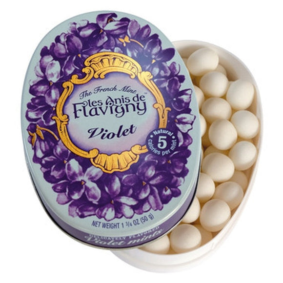 Floral and sweet, these Violet mints will leave you feeling minty and fresh. These all-natural violet-flavored candies are housed in a vintage decorative tin, with about 30 mints per tin. Each anise seed is coated in naturally-flavored sugar to produce round and smooth flavored mints that will delight the palate and senses.  Ingredients: Sugar, Natural Flavoring, Green Aniseed