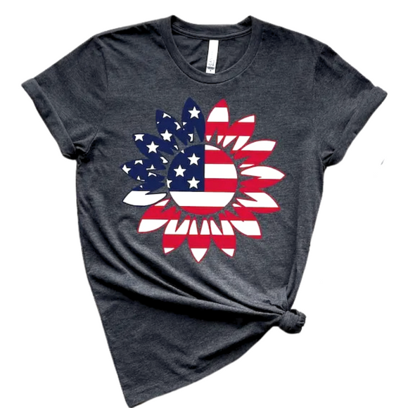 You'll want to wear this American Sunflower tee all summer long! This charcoal grey tee has one large sunflower shape on the front that has the Stars & Stripes in Red, White & Blue on it! The shirts are soft Bella and Canvas unisex fashion-fit tees that fit like a well-loved favorite, featuring a crew neck and short sleeves.

100% Airlume combed and ring-spun cotton.

Made in the United States