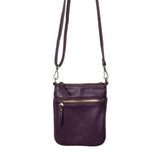 This aubergine colored compact phone bag is designed for everyday convenience and hands-free style. This slim crossbody is made from softly tumbled vegan leather with a sleek silhouette, adjustable crossbody strap and a secure zip closure. The Lia features a front zip pocket and a back slide pocket to keep your phone, cards, keys and small essentials neatly organized and easy to access. This crossbody bag is perfect for travel, shopping, concerts or daily errands.
Product Details
Dimensions: 7.5 in. H x 6.2