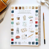 Twelve baking illustrations — a cupcake, layer cake, mixing bowl, lattice pie, tray of cookies, rolling pin with cookie cutters, and more — each pre-outlined with step-by-step instructions. Paintings take about thirty minutes from start to finish, making it approachable for first-time painters and a favorite for gifting.

Details: - 12 beginner-friendly illustrations

Thick 120lb watercolor paper

&nbsp;Lay-flat pages with spiral binding for hassle-free painting and easy tear-out

Lightly outlined sketches 