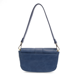 So stylish and chic the Becca baguette bag in celestial blue brings polish to your look. &nbsp;Made in our best-selling vintage vegan leather in of the moment fashion colors, this adorable bag comes with two shoulder straps for versatility, a short strap to carry as a short shoulder or a long adjustable strap to wear as a crossbody bag when you want to be hands free.&nbsp; Even upgrade your look and express your personality by adding one of our coordinating Guitar Straps.


Dimensions: 4.5 in. H x 8 in. W x