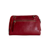 Retro styling crafted in antiqued vegan leather gives this rich crimson red. clutch a vintage vibe. The removable woven wrist strap is the finishing touch on this stylish bag so you can wear it as a wristlet, a clutch, or a crossbody with the included removable shoulder strap!





6.75"H x 9.75"W x 2.25"D

Removable and adjustable crossbody strap 22"-26"

Removable long wristlet strap 7.5" long

Zippered top closure

Interior zippered pocket

Exterior back zipper pocket

Brass plated hardware

100% vegan l