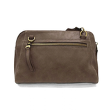Retro styling crafted in antiqued vegan leather gives this taupe clutch a vintage vibe. The removable woven wrist strap is the finishing touch on this stylish bag so you can wear it as a wristlet, a clutch, or a crossbody with the included removable shoulder strap!





6.75"H x 9.75"W x 2.25"D

Removable and adjustable crossbody strap 22"-26"

Removable long wristlet strap 7.5" long

Zippered top closure

Interior zippered pocket

Exterior back zipper pocket

Brass plated hardware

100% vegan leather (poly