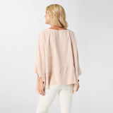 Relaxed and effortlessly chic, the Peyton Frayed Edge Poncho is a versatile layering piece designed for easy, everyday wear. Featuring a soft drape and wide, flowy silhouette in a beauitful sand color, this poncho is finished with subtle frayed edge detailing for a casual, lived‑in feel. Lightweight and comfortable, it layers beautifully over tanks or tees and pairs effortlessly with denim for a polished yet laid‑back look.

Materials: Cotton.

One size fits most.