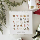 Twenty-five small cards, twenty-five days of waiting well. This set gives you one verse a day with a Christmas illustration, from December 1st to Christmas, something quietly constant to return to while everything else picks up speed. The cards come in a keepsake box, so the set works as a gift on its own. Keep the stack of cards in a stand on the counter, tuck one into a card for a friend, or use them as bookmarks along the way.

Details: - set of 25 cards - 4" x 4" - comes in a keepsake box - stands sold 