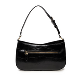 The sleek black Erin Hobo will compliment your look for the office or your next night out. Fashioned in glossy croc embossed vegan leather, this sophisticated bag closes with a brass zipper to keep your belongings secure and is accented with burnished brass rings that open to allow you to change the shoulder straps. Two shoulder straps are included with this stylish Hobo, a short strap to carry close to the body or a long strap to carry as a shoulder bag or as a crossbody. Both straps are adjustable and rem