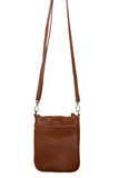 This cognac colored compact phone bag is designed for everyday convenience and hands-free style. This slim crossbody is made from softly tumbled vegan leather with a sleek silhouette, adjustable crossbody strap and a secure zip closure. The Lia features a front zip pocket and a back slide pocket to keep your phone, cards, keys and small essentials neatly organized and easy to access. This crossbody bag is perfect for travel, shopping, concerts or daily errands.
Product Details
Dimensions: 7.5 in. H x 6.25 i