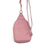 Blending uptown chic with downtown cool, the Skyler sling bag is made in pretty raspberry vegan leather! A convertible strap lends versatility, while a front zip pocket offers practical storage for your necessities. It is the perfect companion for a night out on the town or a fun day trip!


8" h x 5.5" w&nbsp; x 2.25" d
Removable and adjustable convertible strap 20"-30" drop
Zippered top closure
Exterior front zip pocket
2 exterior zip compartments
4 interior credit card pockets
Brass plated hardware
100% 