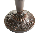 Decorative metal base with intricate designs on a white background