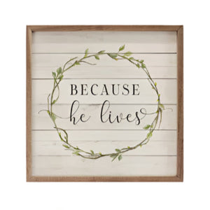 Get ready for Easter with this beautiful mini sign!&nbsp; On a whitewashed wooden background is a small green wreath with the words "Because he lives" written in the center.

This unique piece is a simple way to bring beauty and charm to any wall or shelf within the home. It is made from high-quality American hardwood planks with a hand-painted face, printed with UV-cured ink, and is framed in a natural walnut frame. Each piece is unique with its own personality, marks, wood grain, and look. Easy to clean w