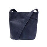 You're going to love this richly textured vegan leather bucket bag in a beautiful navy color fashioned with a spacious interior and adjustable strap. The asymmetrical front pocket is the perfect place to stow your phone or keys to keep them in easy reach. The Bindi is the perfect bag to carry as a crossbody as it is lightweight yet holds everything you might need for the day.


Dimensions: 11 in. H x 11.5 in. W x 4 in. D
Magnetic snap closure
Adjustable shoulder strap: 16 in. - 21.5 in. drop
Brass plated ha