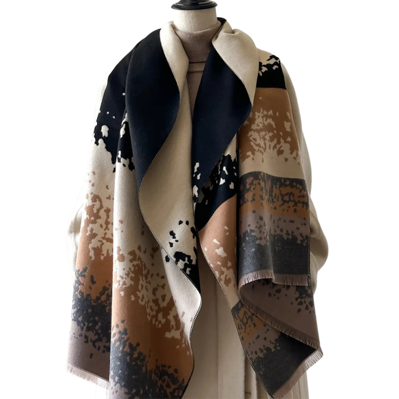 This one size fits all reversible wrap, drapes over and accents any outfit, casual or dressy. It feels and looks like cashmere. A beautiful layering piece!

55% Poly, 45% Viscose.

Dry clean or hand wash cold with light colors, lay flat to dry, iron on lowest setting if need, do not bleach.