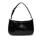 The sleek black Erin Hobo will compliment your look for the office or your next night out. Fashioned in glossy croc embossed vegan leather, this sophisticated bag closes with a brass zipper to keep your belongings secure and is accented with burnished brass rings that open to allow you to change the shoulder straps. Two shoulder straps are included with this stylish Hobo, a short strap to carry close to the body or a long strap to carry as a shoulder bag or as a crossbody. Both straps are adjustable and rem