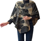 Cozy Cashmere Like Travel Wrap This one size fits all reversible loop wrap, drapes over and through shoulder loop to stay in place. Accents any outfit, casual or dressy. It feels and looks like cashmere. A beautiful layering piece!

60% Poly, 40% Acrylic.

Dry clean or hand wash cold with light colors, lay flat to dry, iron on lowest setting if need, do not bleach.