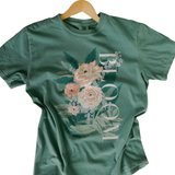 You're going to love our whimsy + colorful tee. Hand-drawn pinky/ peach and blue florals take center stage, enriched in playful monochromatic colors with the word "BLOOM" is written along the side in white.

Comfort Color Unisex Tee 100% Cotton